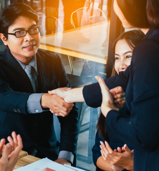 Successful business people shaking hands, finishing up a meeting Successful business people shaking hands, finishing up a meeting.